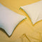  Two Marlow Pillows on yellow sheets