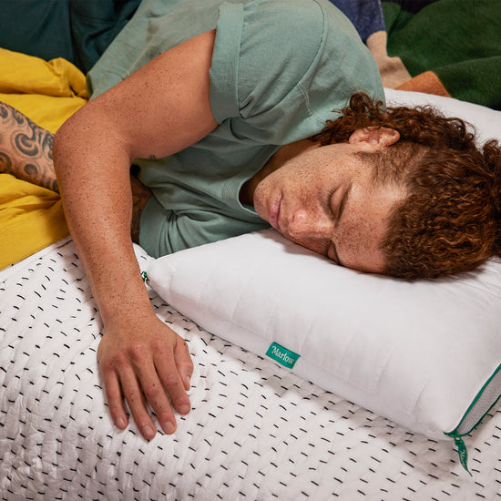  man sleeping using Marlow pillow